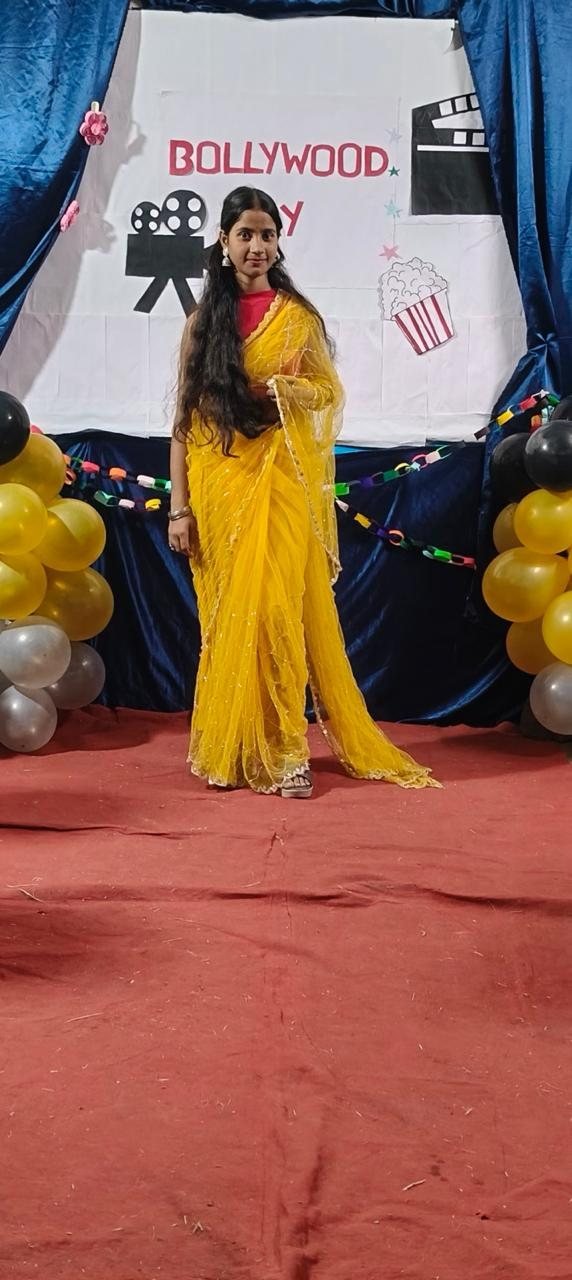 Participant in a yellow saree at Bollywood Day