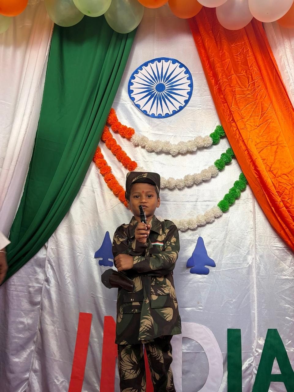 Student in an army costume at the Independence Day stage