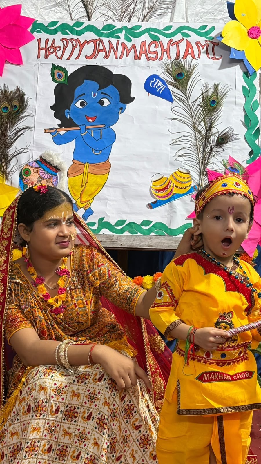 Little Krishna with a student dressed as Yashoda at Janmashtami